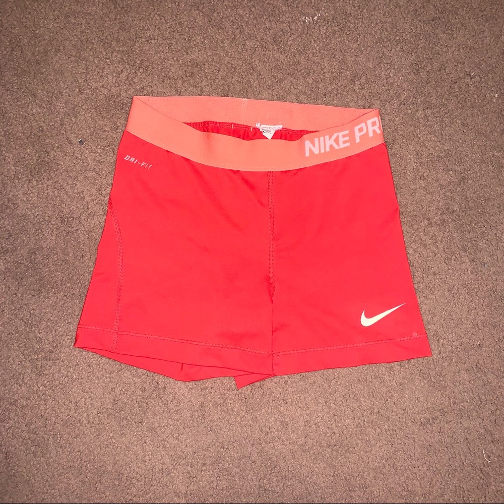 Orange/coral Nike pro shorts